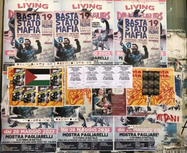 posters on wall in Palermo