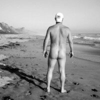 nude male model on beach