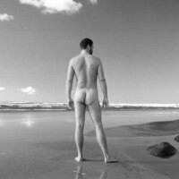 nude male model on beach