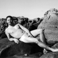 nude male model on beach