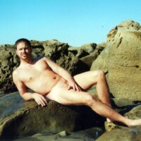 nude male model on beach