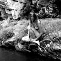 nude woman at creek side